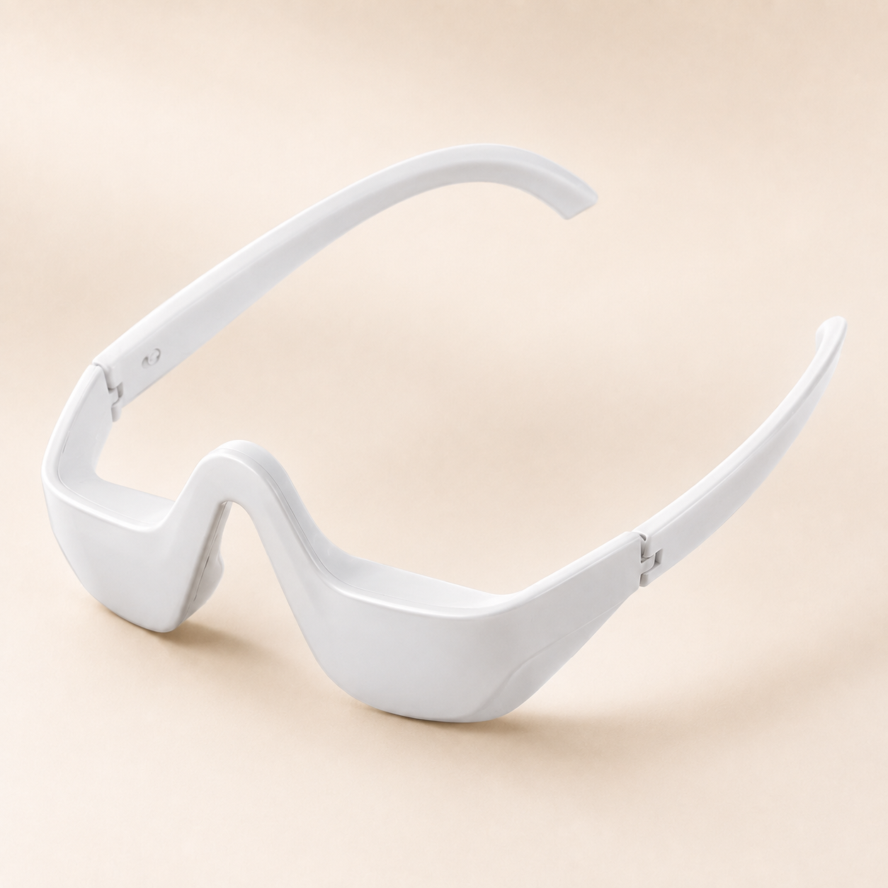 Lumae white eye device, three-quarter angle on a porcelain backdrop